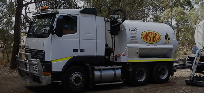 WASTECO waste removal truck